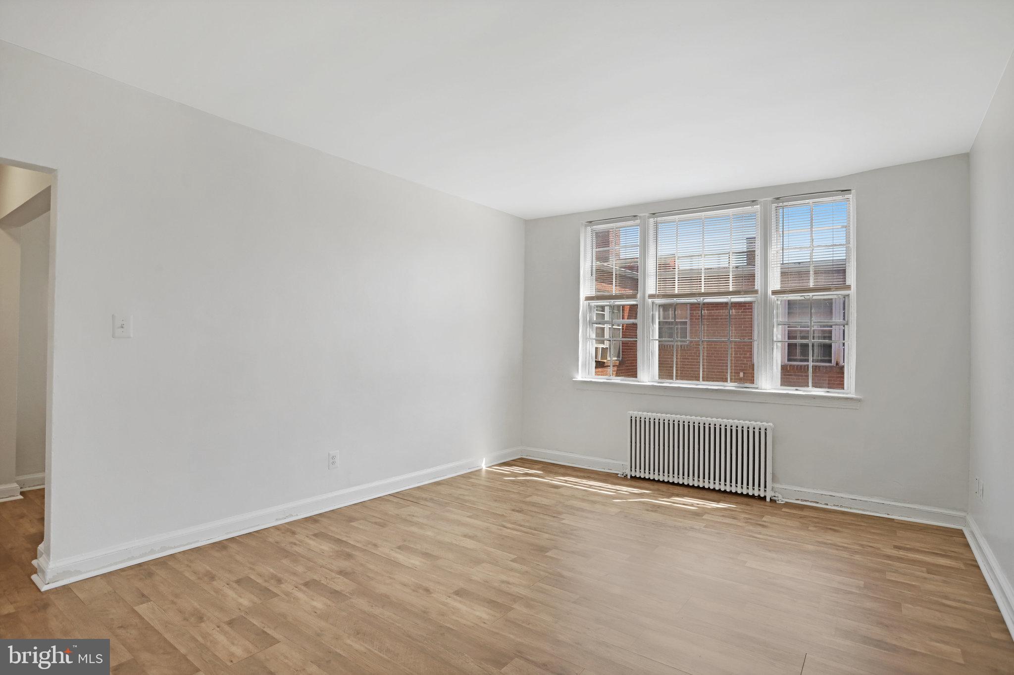 1446 Tuckerman Street Northwest, Unit 306 Washington, DC 20011 - Photo 9 of 26 a view of an empty room with a window