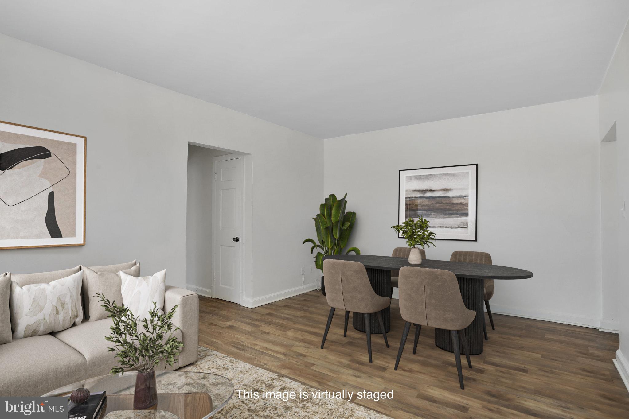 1446 Tuckerman Street Northwest, Unit 306 Washington, DC 20011 - Photo 10 of 26 a living room with furniture and wooden floor