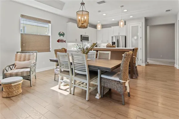 a view of a dining room with furniture window and wooden floor