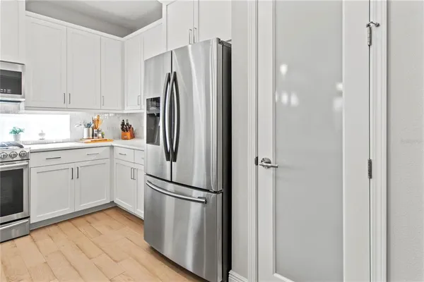 a kitchen with a sink stove and microwave