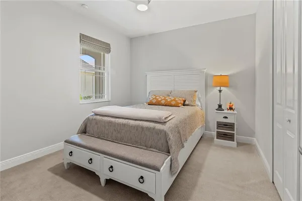 a bedroom with a bed and pillows