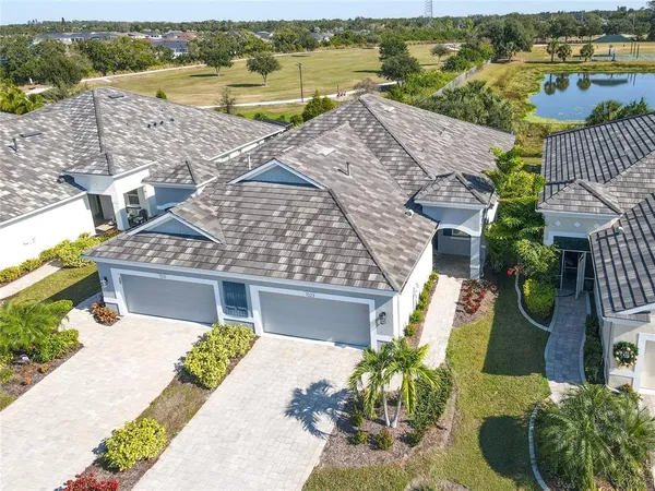 an aerial view of residential houses with outdoor space