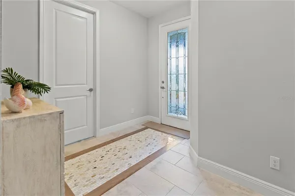 a view of an entryway with wooden floor