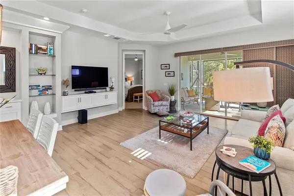 a living room with furniture fireplace and flat screen tv
