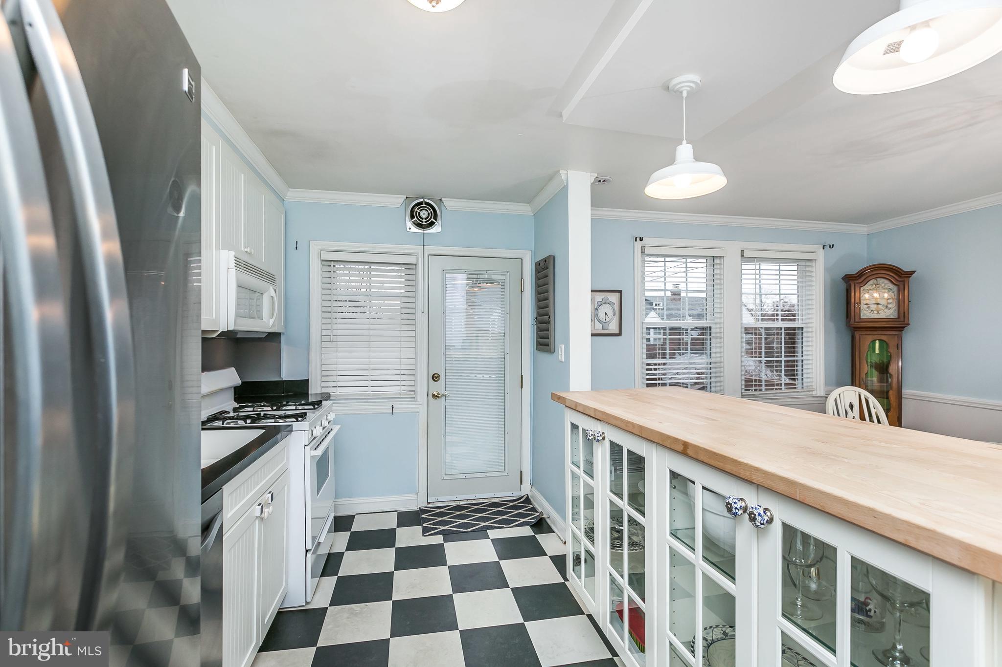 326 Overbrook Road Baltimore, MD 21212 - Photo 11 of 35 a kitchen with stainless steel appliances granite countertop a stove and a refrigerator