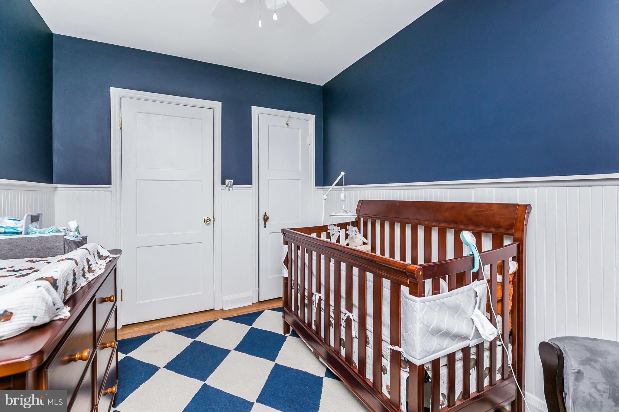 326 Overbrook Road Baltimore, MD 21212 - Photo 17 of 35 a bedroom with a bed and wooden floor