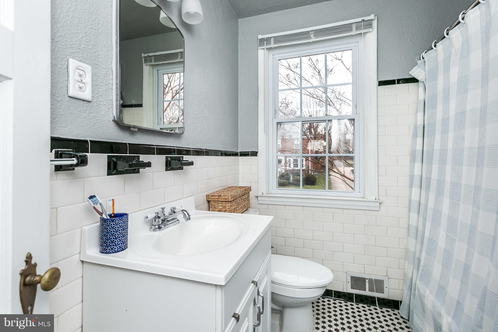326 Overbrook Road Baltimore, MD 21212 - Photo 18 of 35 a bathroom with a sink toilet and mirror