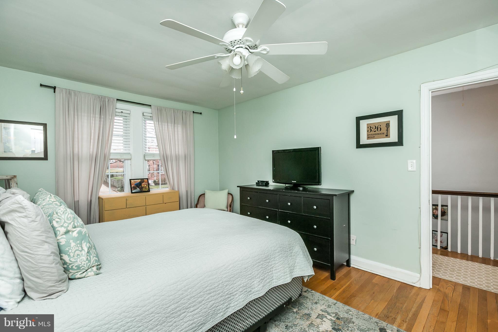 326 Overbrook Road Baltimore, MD 21212 - Photo 21 of 35 a bedroom with a bed and a flat screen tv