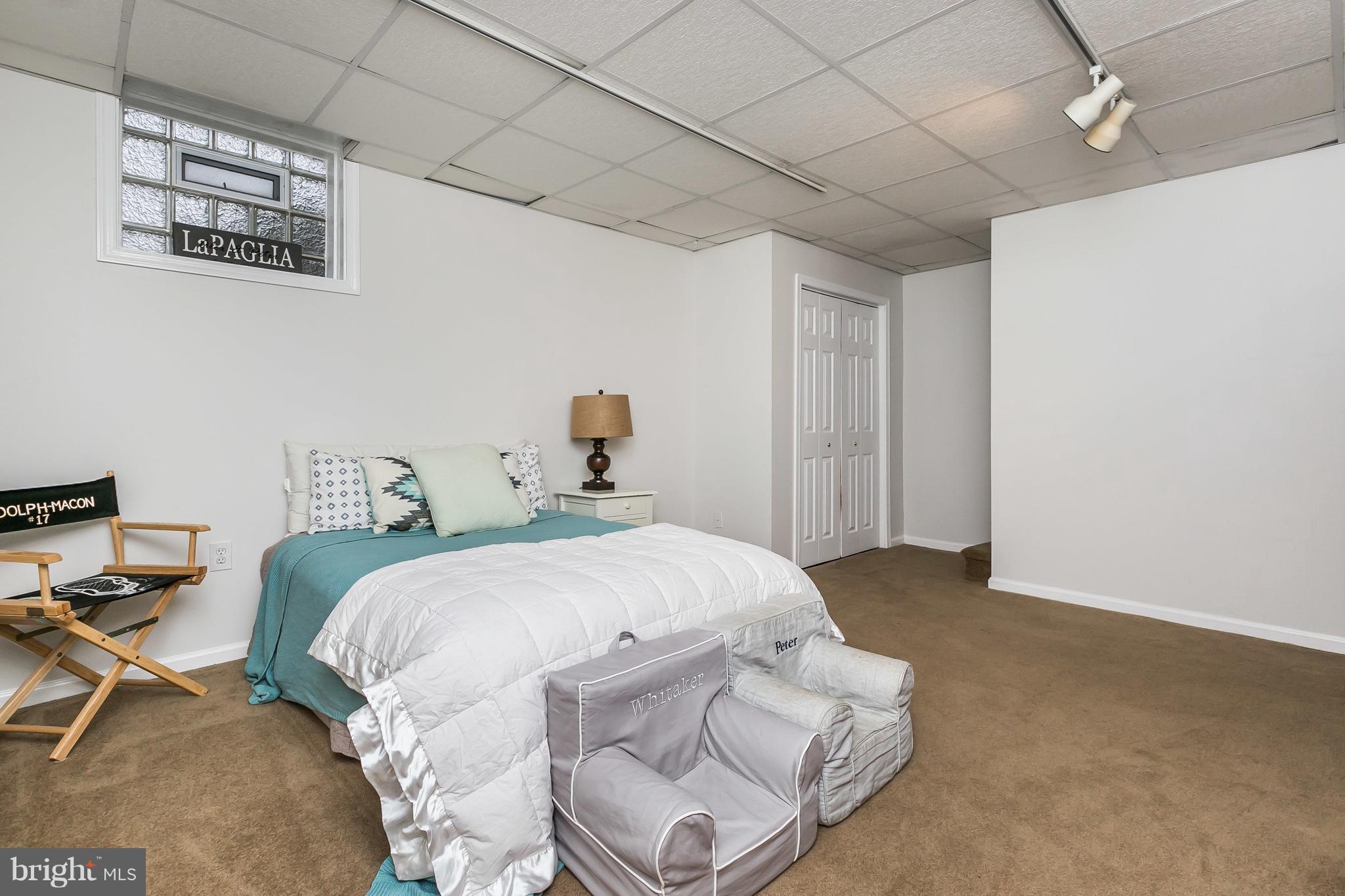 326 Overbrook Road Baltimore, MD 21212 - Photo 24 of 35 a bedroom with a bed and a chair