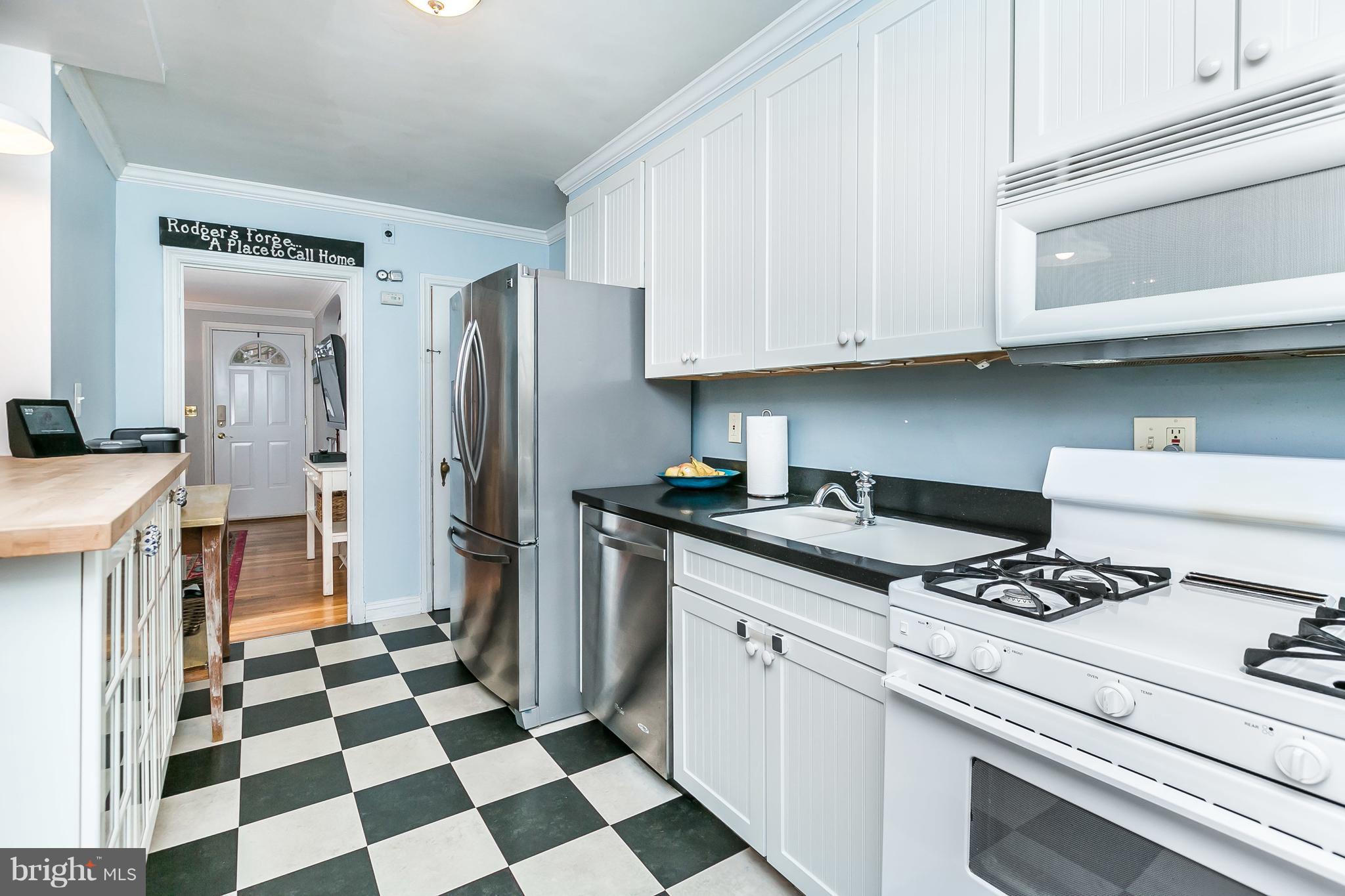 326 Overbrook Road Baltimore, MD 21212 - Photo 10 of 35 a kitchen with stainless steel appliances granite countertop a refrigerator and a stove