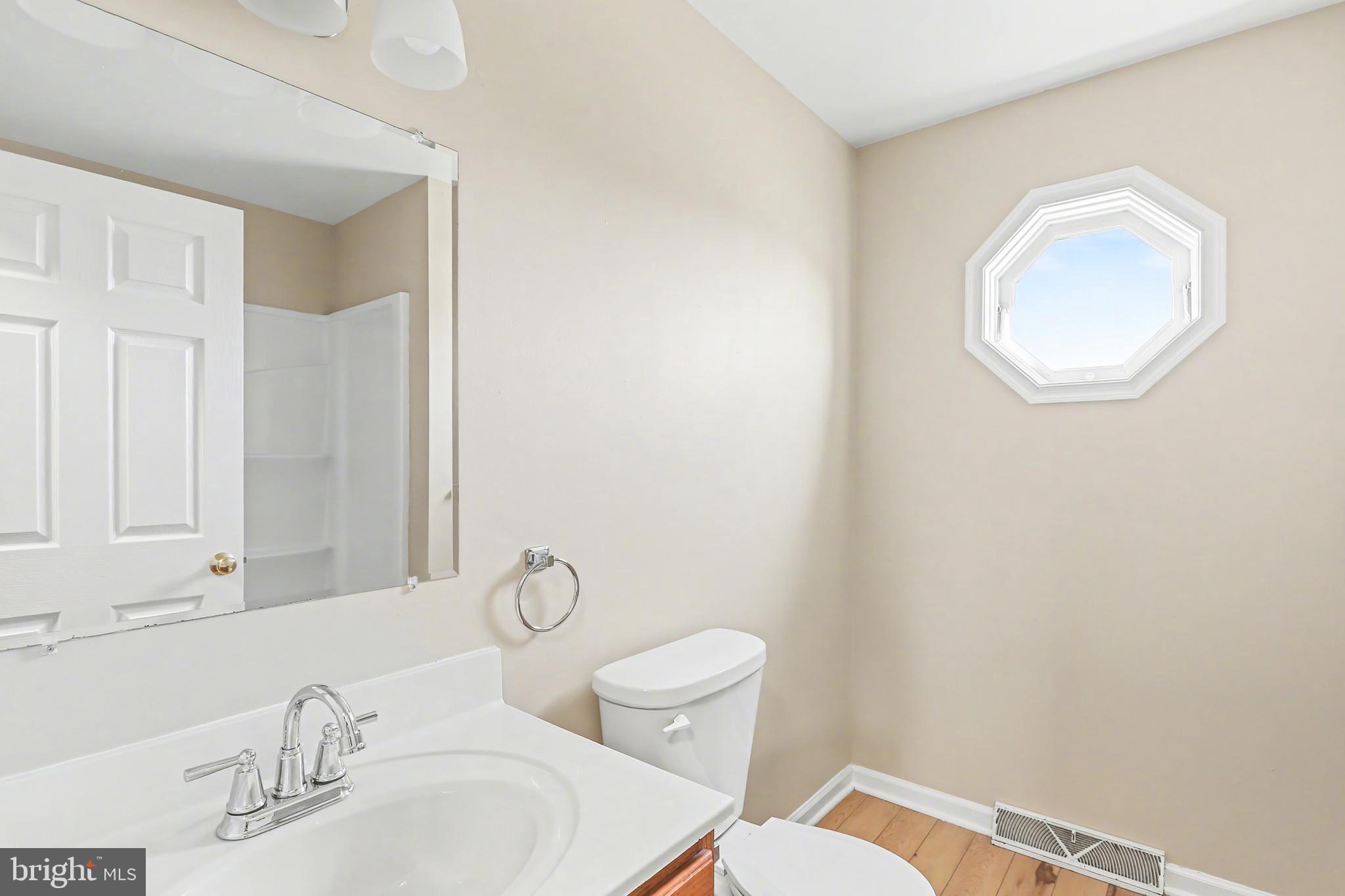 2949 Milky Way Dover, PA 17315 - Photo 7 of 10 a bathroom with a toilet sink and mirror