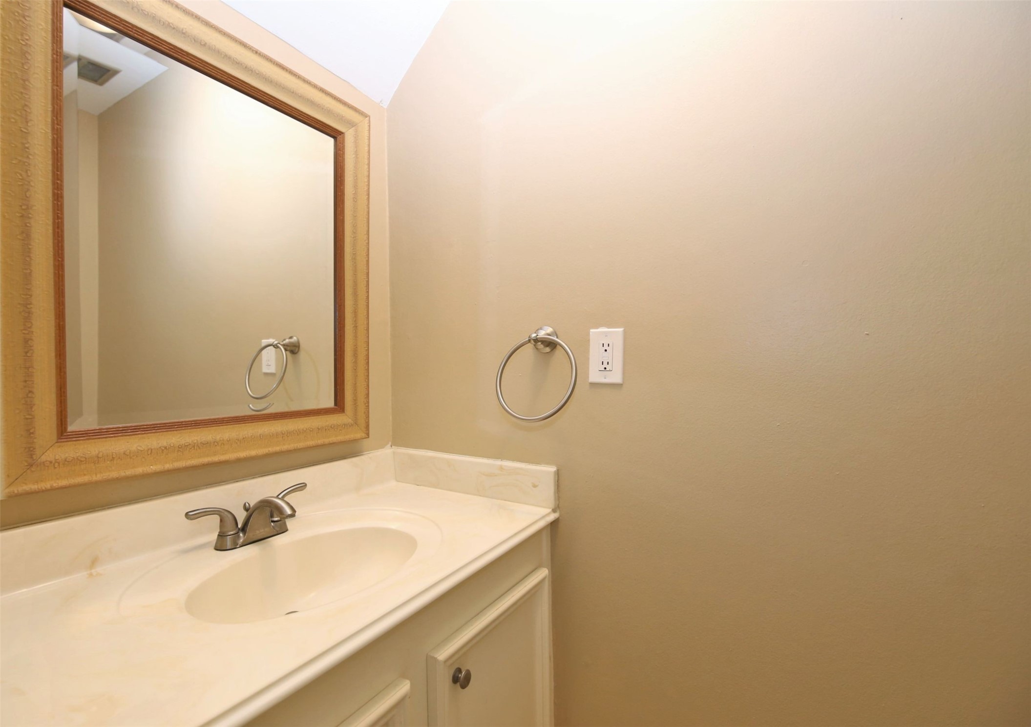 1433 Cedar Post Lane, Unit 27 Houston, TX 77055 - Photo 11 of 18 a bathroom with a sink and a mirror