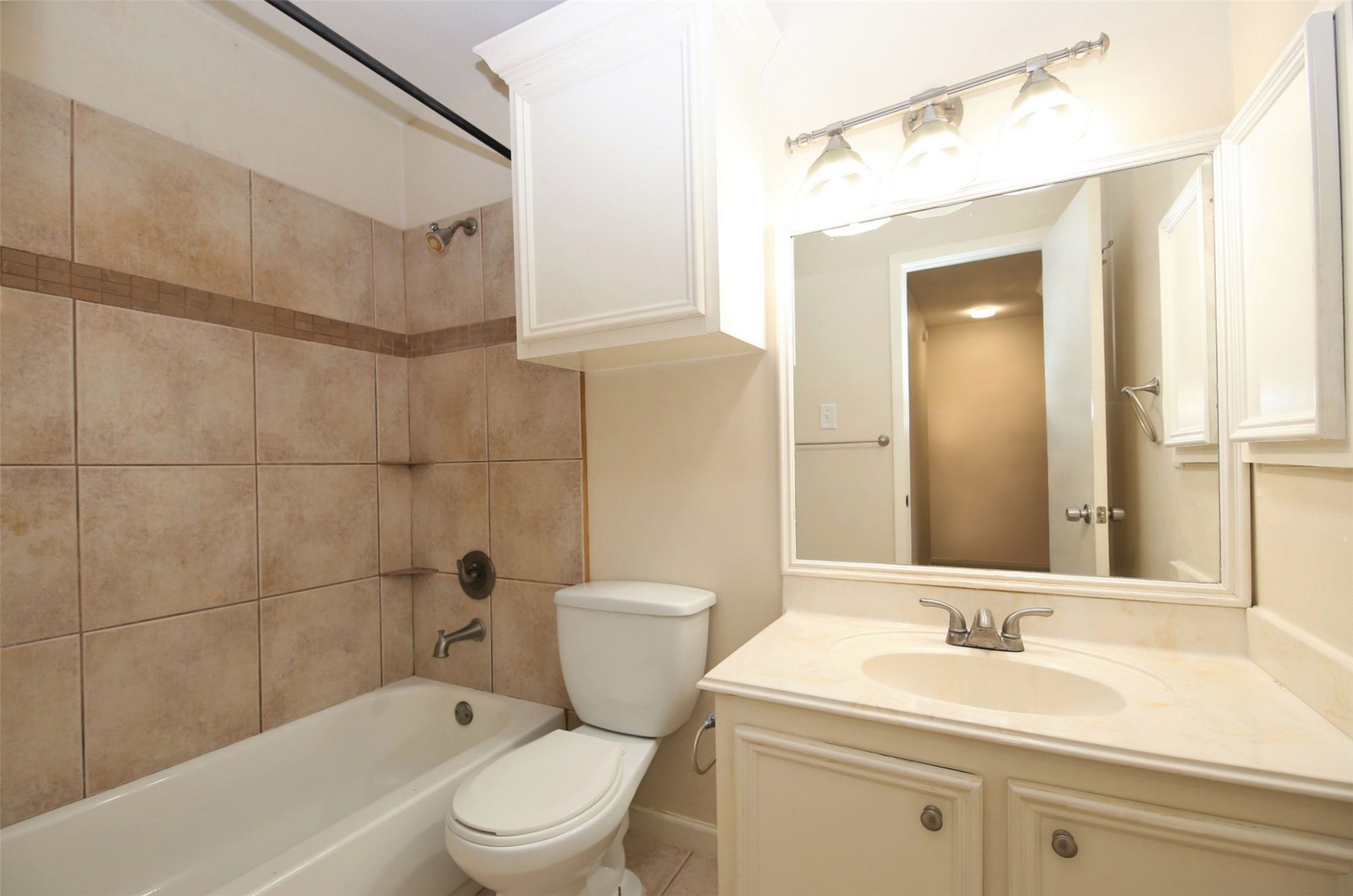 1433 Cedar Post Lane, Unit 27 Houston, TX 77055 - Photo 14 of 18 a bathroom with a sink a toilet and shower