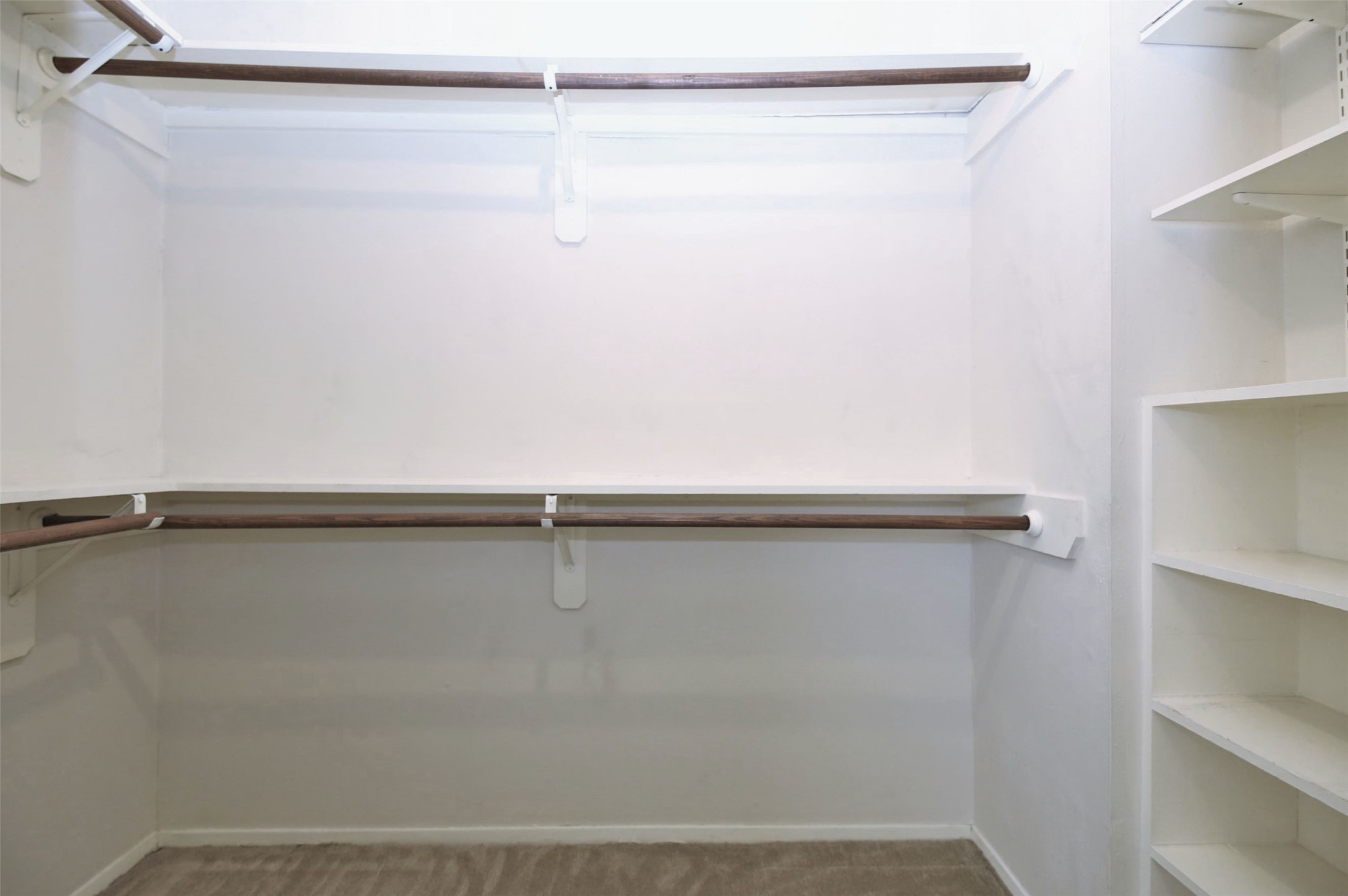 1433 Cedar Post Lane, Unit 27 Houston, TX 77055 - Photo 17 of 18 a view of a room with racks on the wall