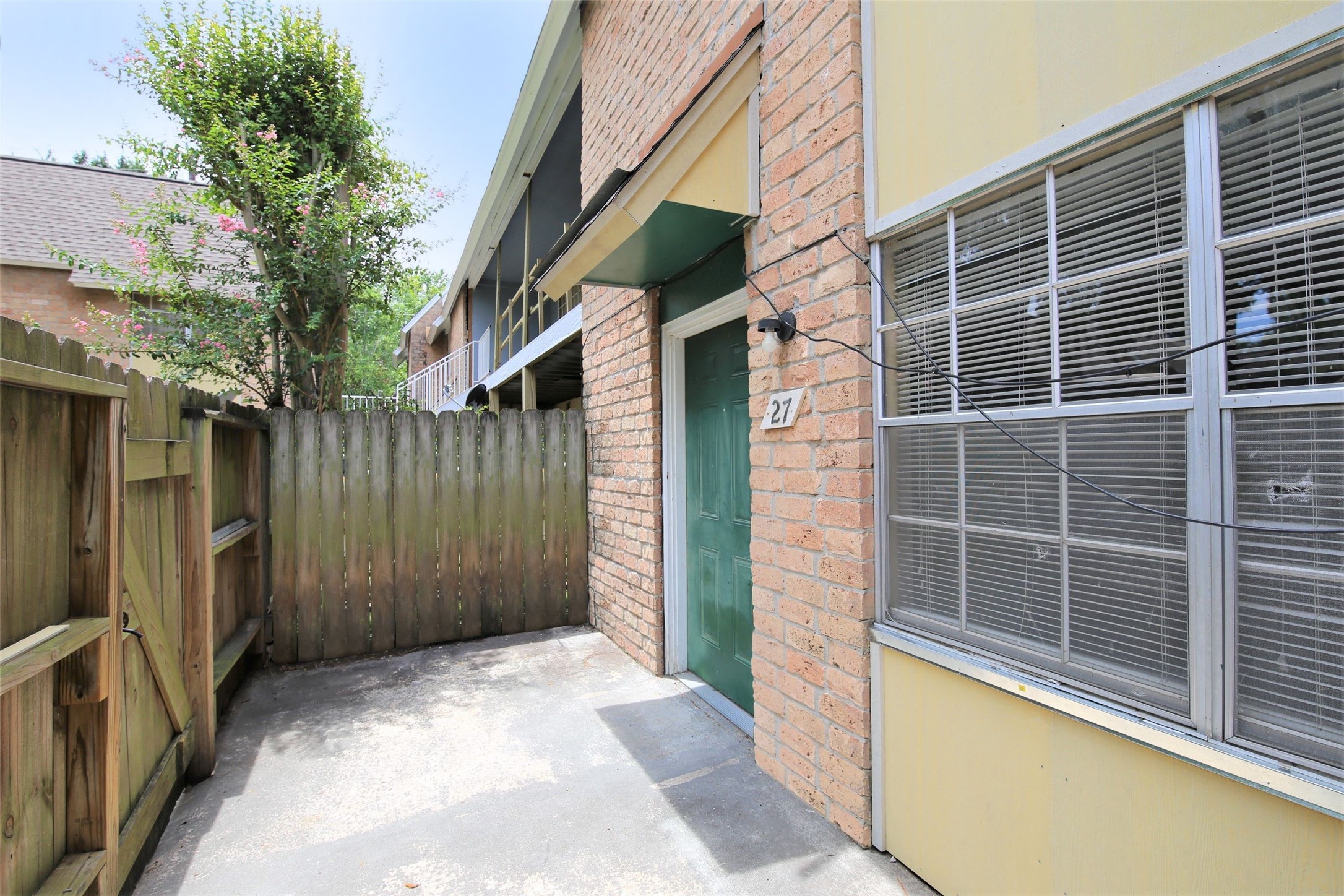 1433 Cedar Post Lane, Unit 27 Houston, TX 77055 - Photo 3 of 18 a view of a house with a backyard