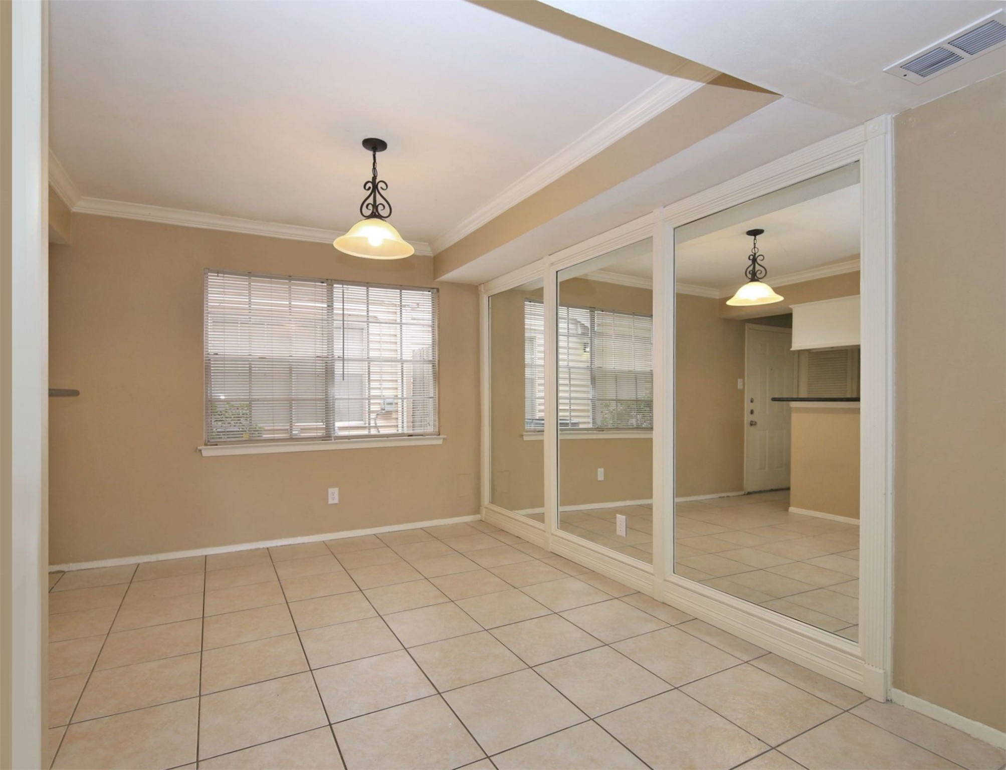 1433 Cedar Post Lane, Unit 27 Houston, TX 77055 - Photo 6 of 18 a view of an empty room with window and cabinet