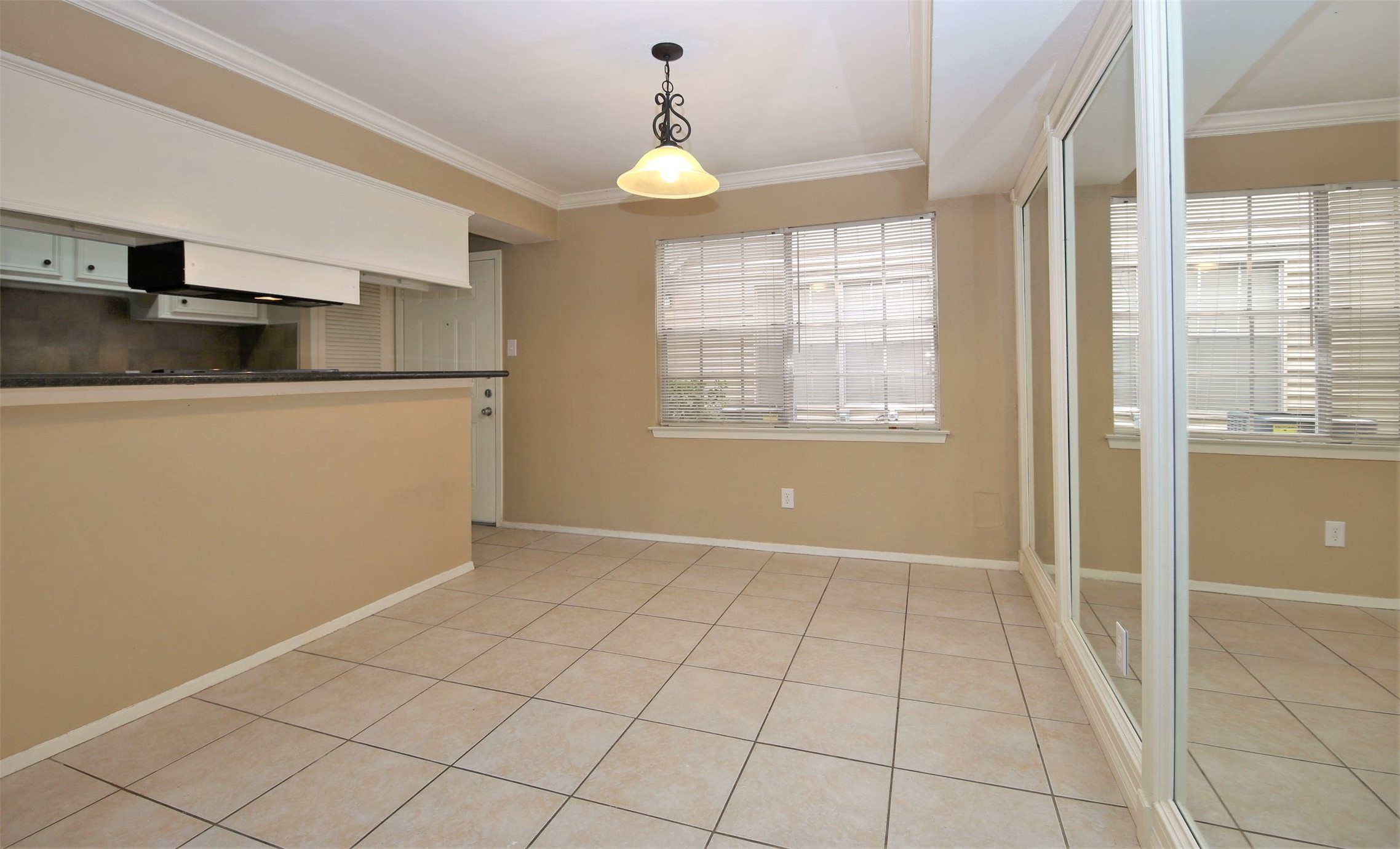 1433 Cedar Post Lane, Unit 27 Houston, TX 77055 - Photo 7 of 18 a view of an empty room with window and chandelier fan