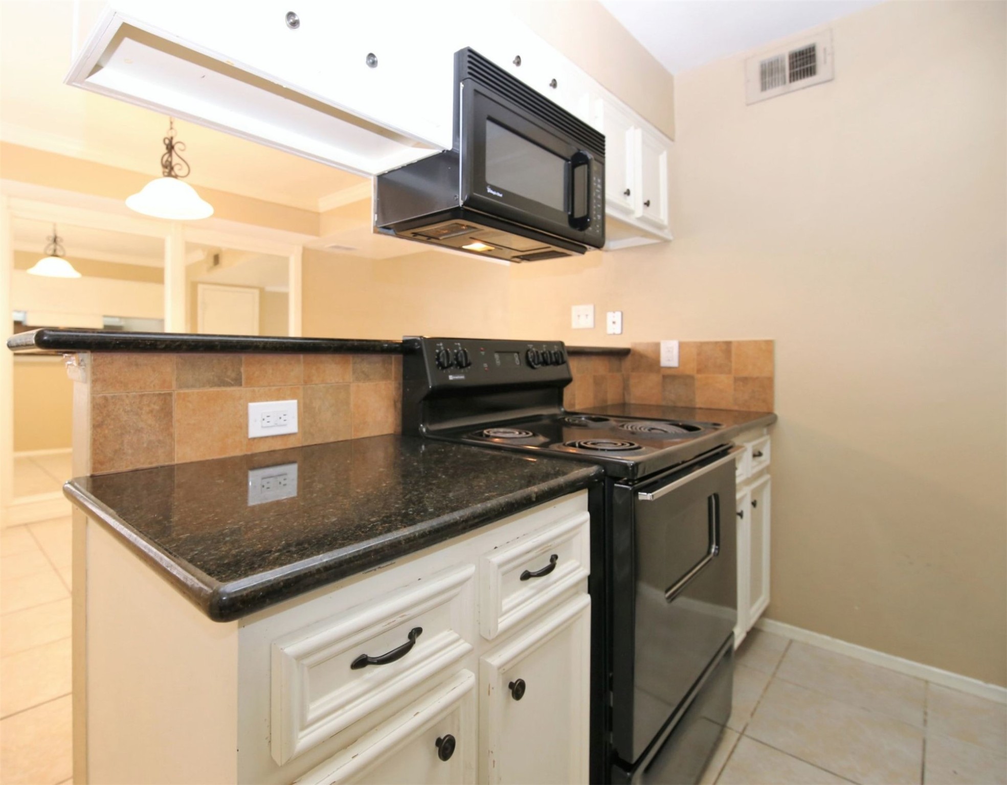 1433 Cedar Post Lane, Unit 27 Houston, TX 77055 - Photo 10 of 18 a kitchen with stainless steel appliances granite countertop a sink and a stove
