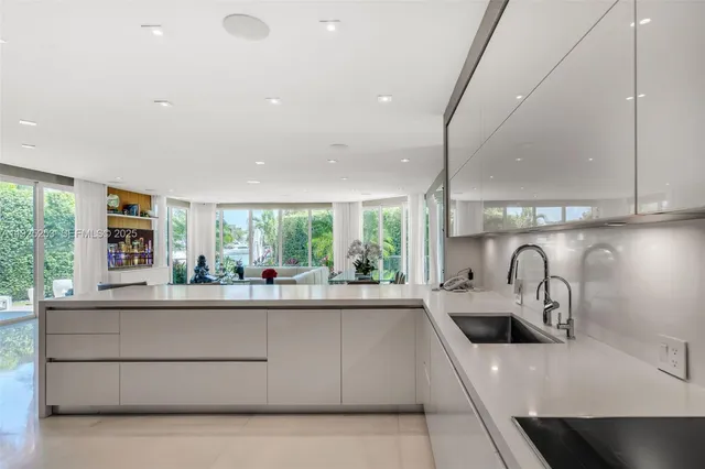 a reading room with furniture a rug and a window
