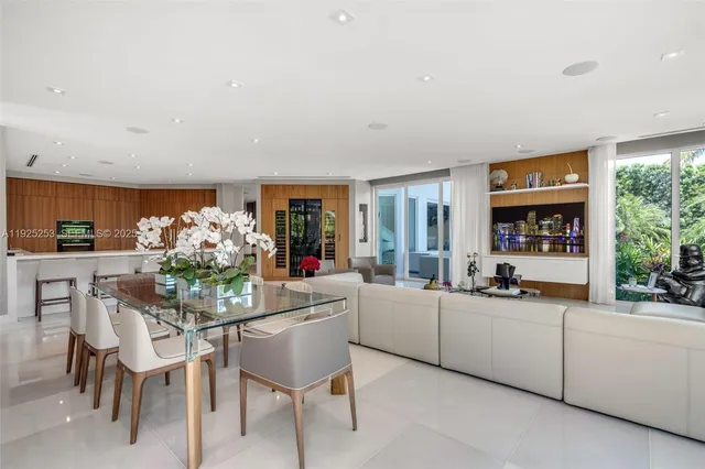 a spacious bedroom with a bed and a large window