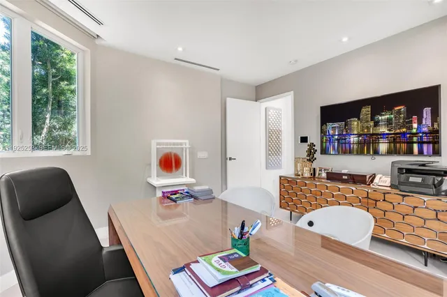a bathroom with a sink and mirror with toilet