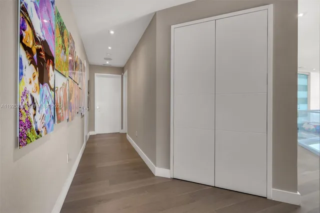 a living room with fireplace furniture and a potted plant