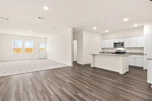 a view of yard with wooden fence