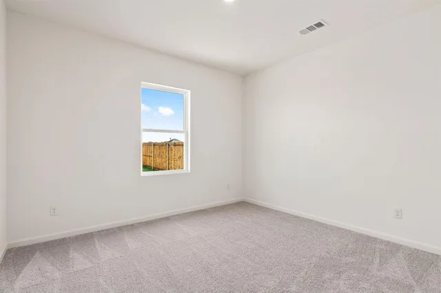 a kitchen with granite countertop a sink stainless steel appliances and cabinets