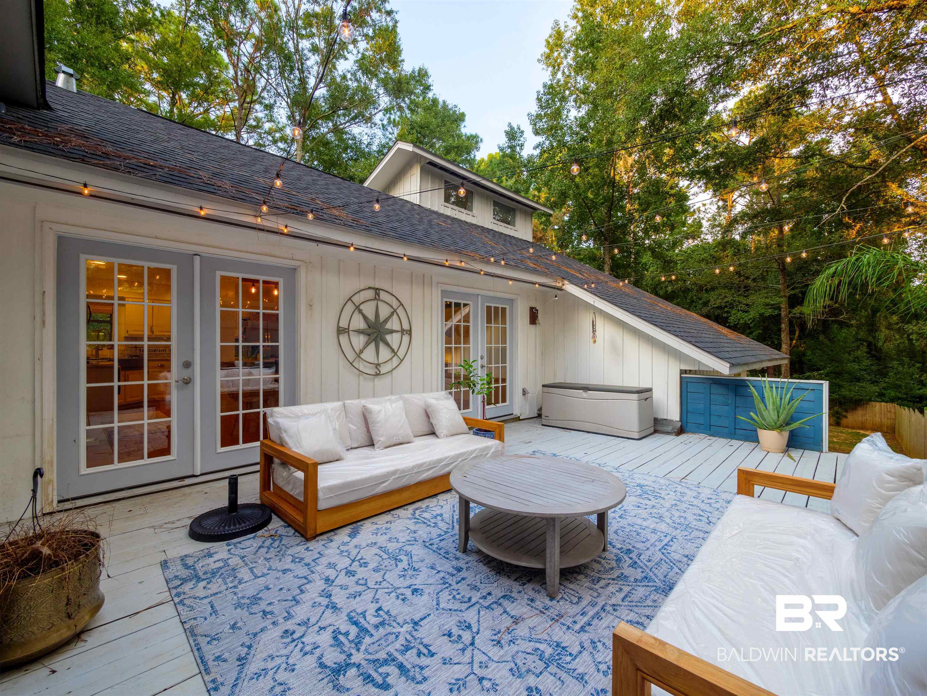 494 Ridgewood Drive Daphne, AL 36526 - Photo 33 of 40 Wooden terrace featuring french doors and outdoor lounge area