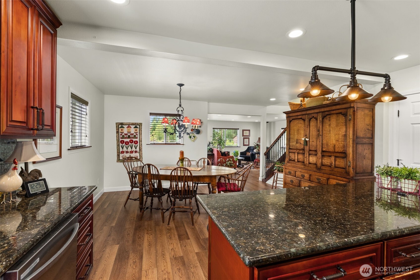 1241 Koontz Road Chehalis, WA 98532 - Photo 31 of 38 a view of a dining room and livingroom with furniture wooden floor a chandelier