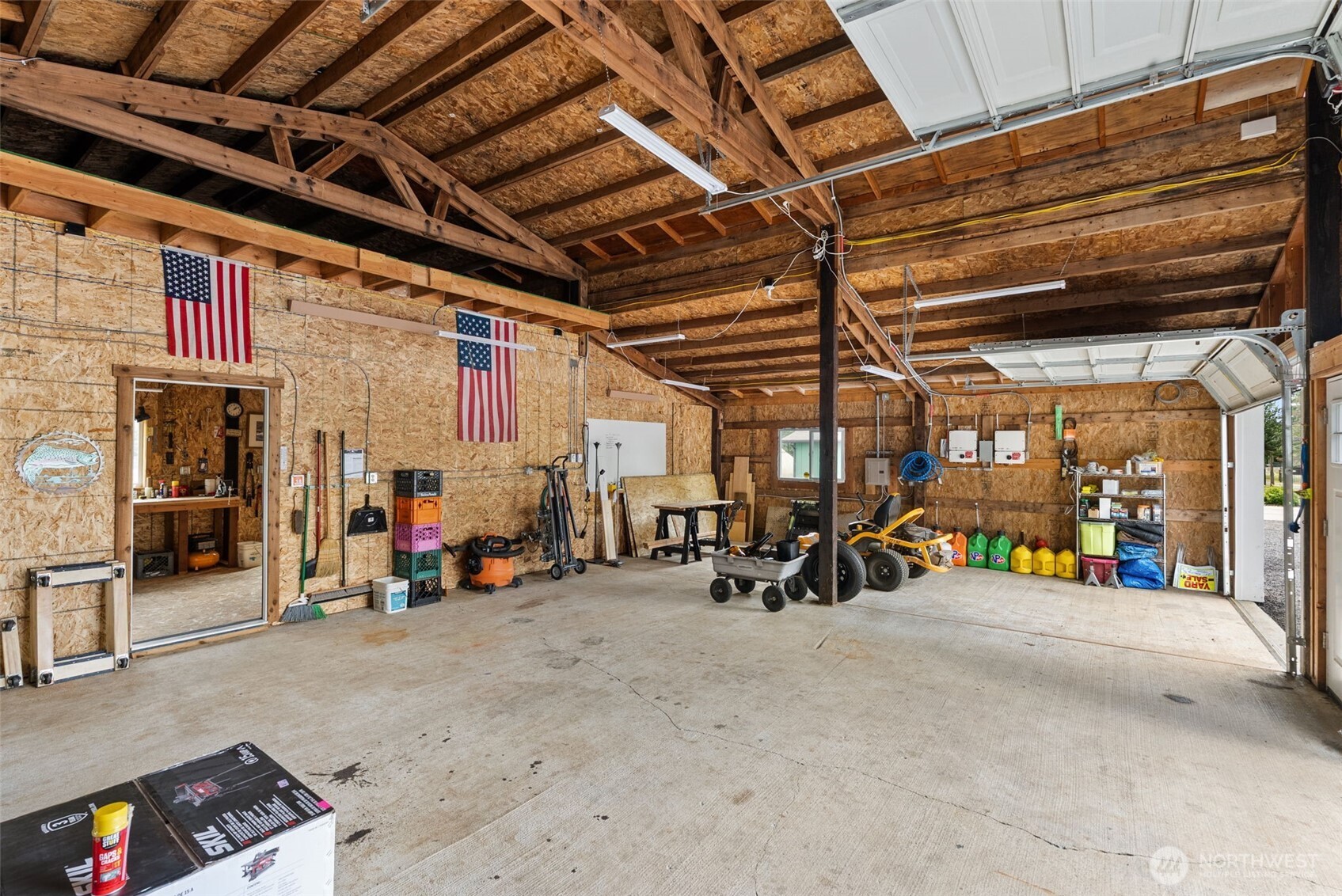 1241 Koontz Road Chehalis, WA 98532 - Photo 7 of 38 a view of a garage with a wooden table and chairs