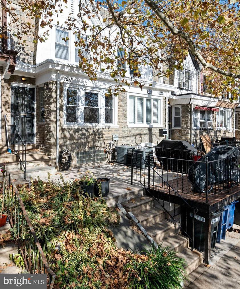 1911 72nd Avenue Philadelphia, PA 19138 - Photo 1 of 27 a front view of a building with street view