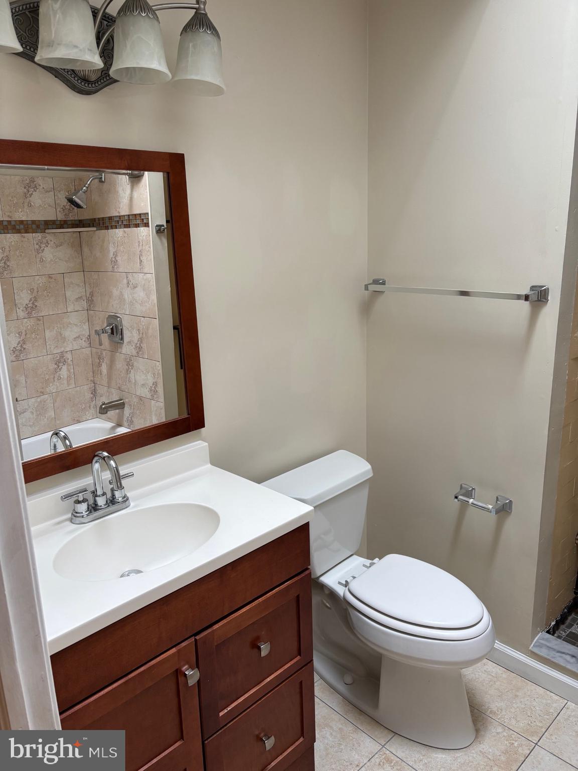 1911 72nd Avenue Philadelphia, PA 19138 - Photo 24 of 27 a bathroom with a sink vanity mirror and toilet