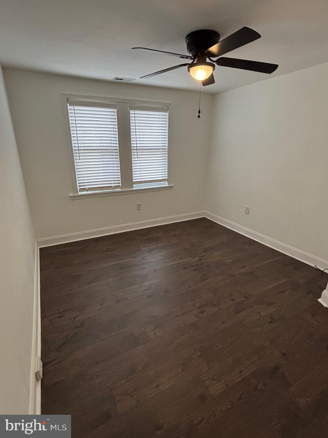 1911 72nd Avenue Philadelphia, PA 19138 - Photo 27 of 27 an empty room with windows and chandelier fan