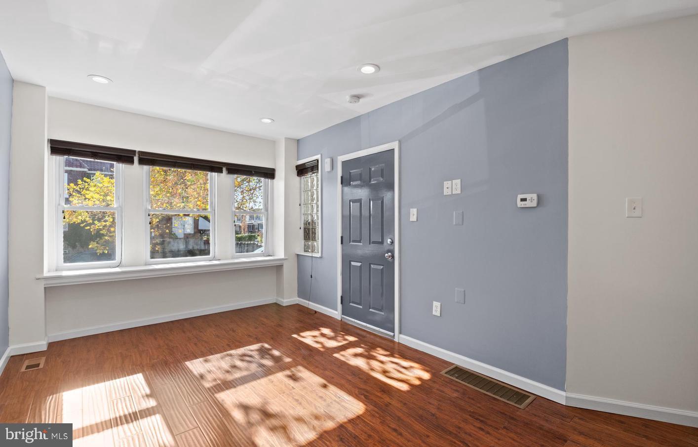 1911 72nd Avenue Philadelphia, PA 19138 - Photo 3 of 27 a view of an empty room with wooden floor and a window