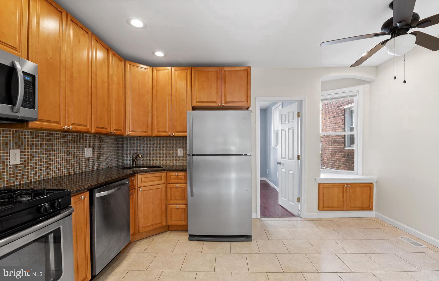 1911 72nd Avenue Philadelphia, PA 19138 - Photo 6 of 27 a kitchen with stainless steel appliances granite countertop a refrigerator a sink and a stove