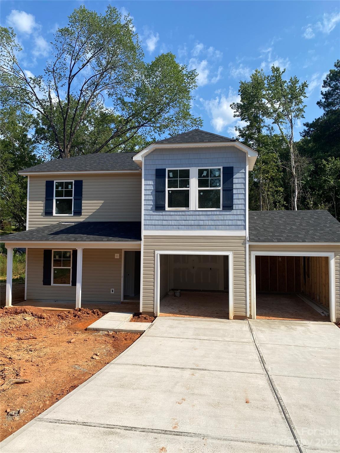 604 Sumter Street Lancaster, SC 29720 - Photo 1 of 1 a front view of a house with a garden