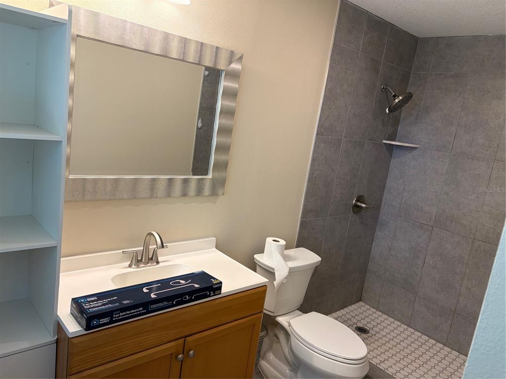 201 Palmetto Road West Nokomis, FL 34275 - Photo 14 of 17 a bathroom with a granite countertop sink toilet and shower