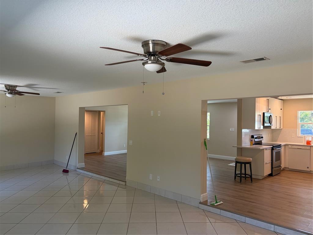 201 Palmetto Road West Nokomis, FL 34275 - Photo 17 of 17 a view of a livingroom with a furniture wooden floor and a ceiling fan