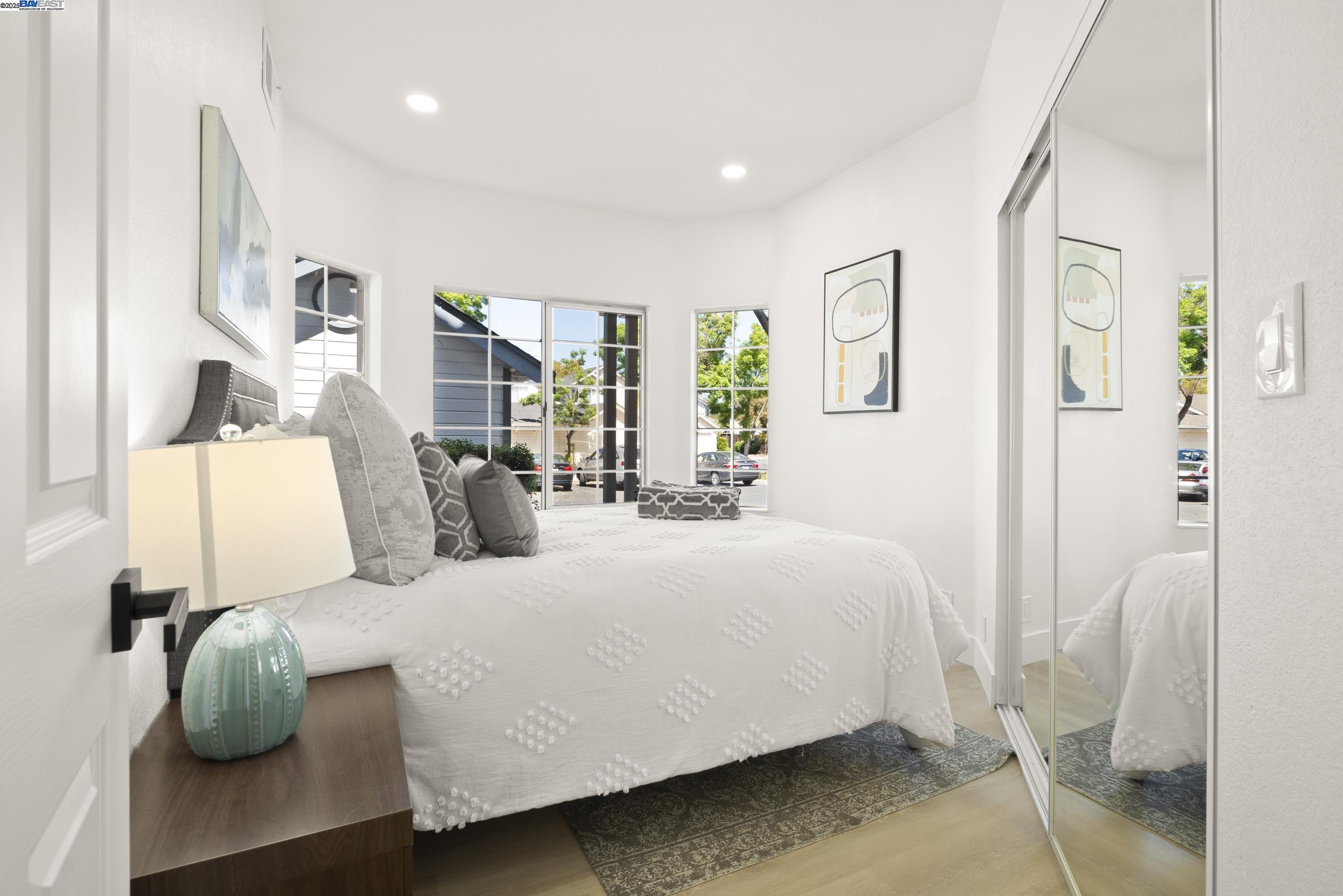 6453 Potrero Drive Newark, CA 94560 - Photo 13 of 34 a bedroom with a large bed and paintings on the wall