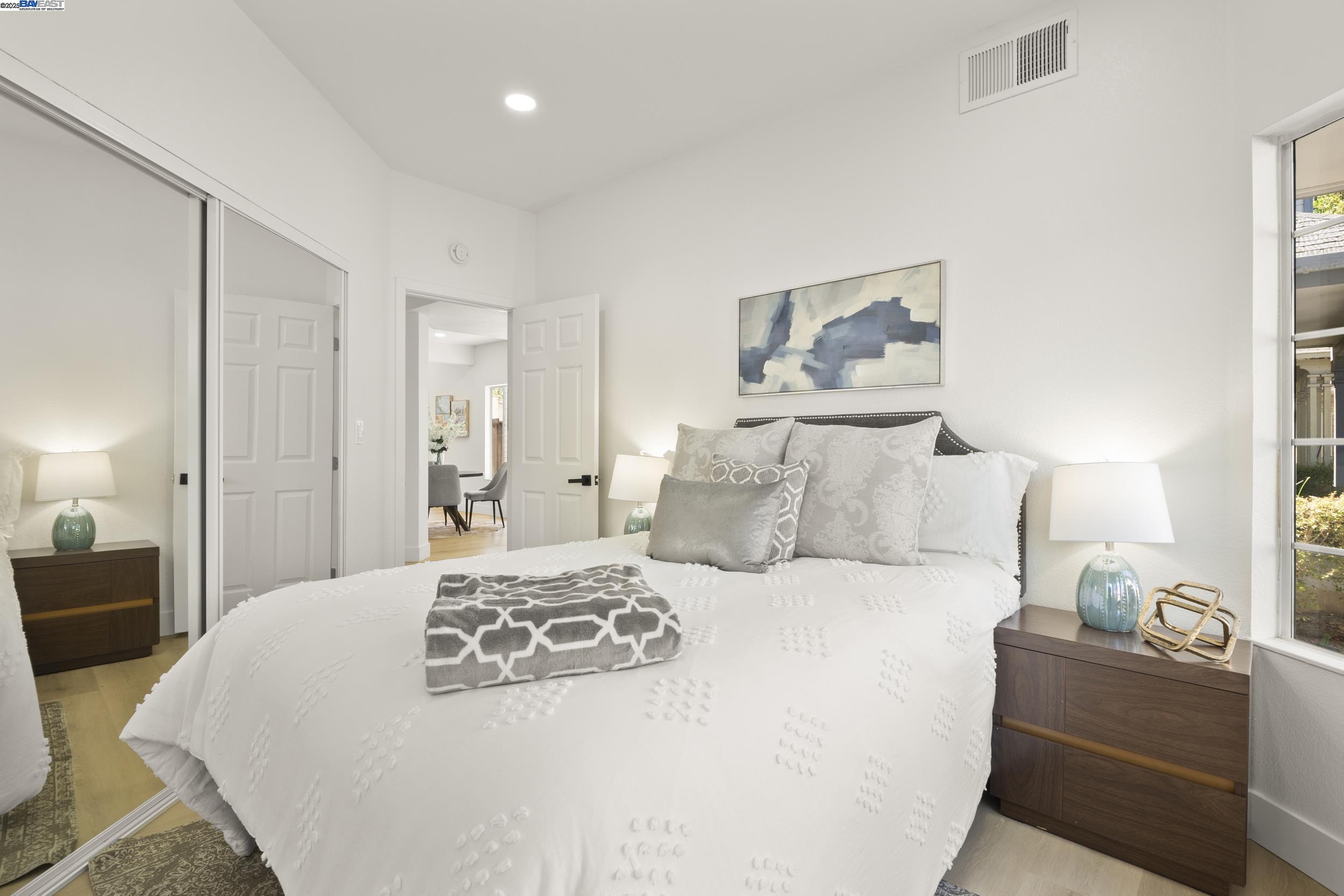 6453 Potrero Drive Newark, CA 94560 - Photo 14 of 34 a bedroom with a bed and a lamp