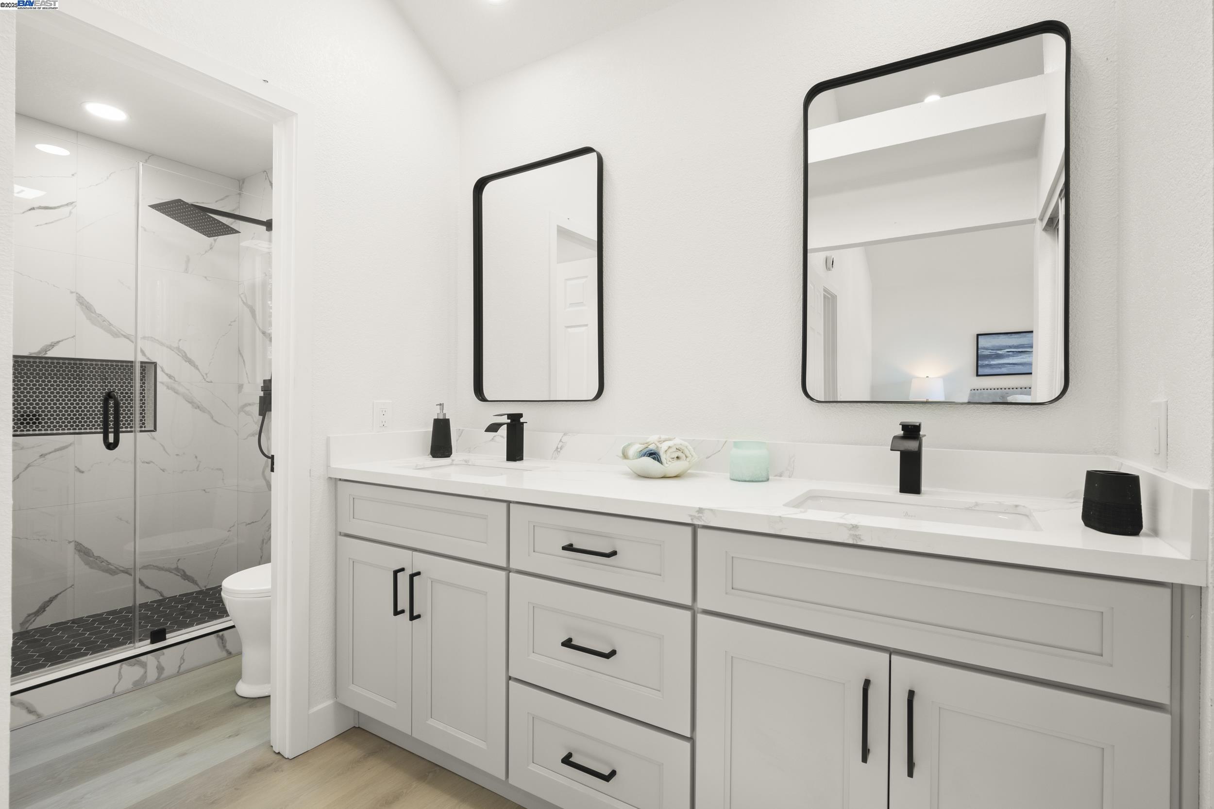 6453 Potrero Drive Newark, CA 94560 - Photo 18 of 34 a bathroom with a double vanity sink mirror and