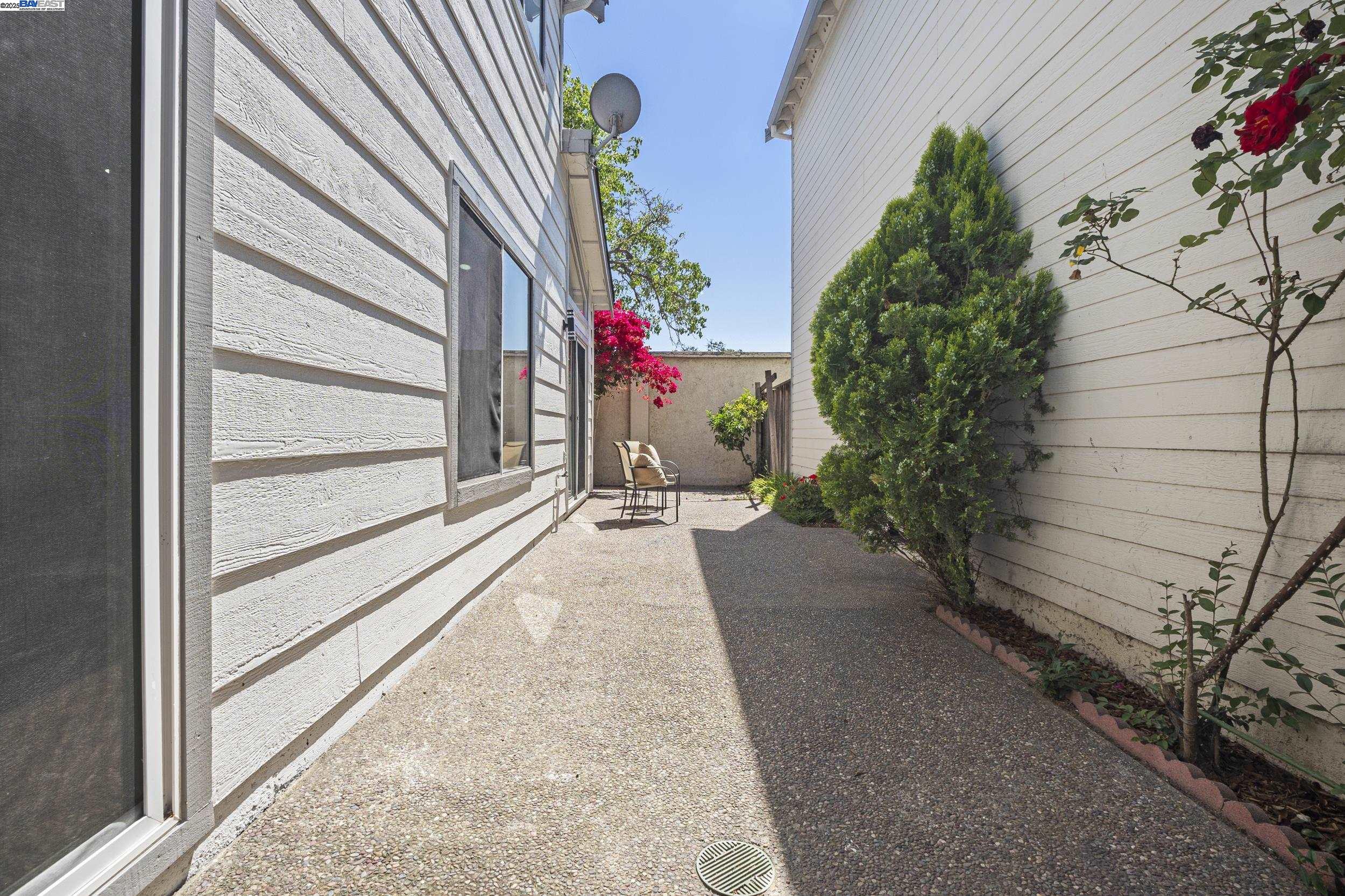 6453 Potrero Drive Newark, CA 94560 - Photo 25 of 34 a view of a house with a flower garden