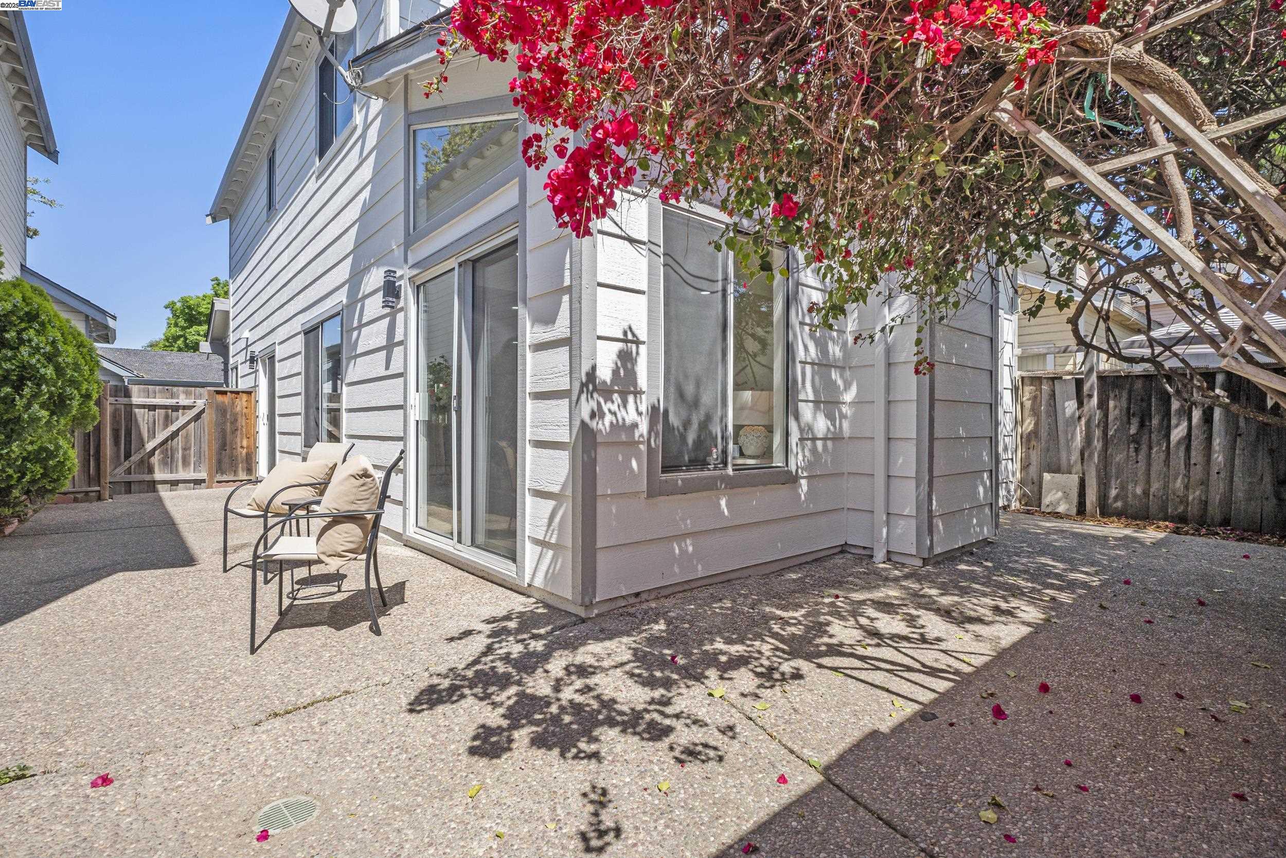 6453 Potrero Drive Newark, CA 94560 - Photo 26 of 34 a patio with a table and chairs and potted plants