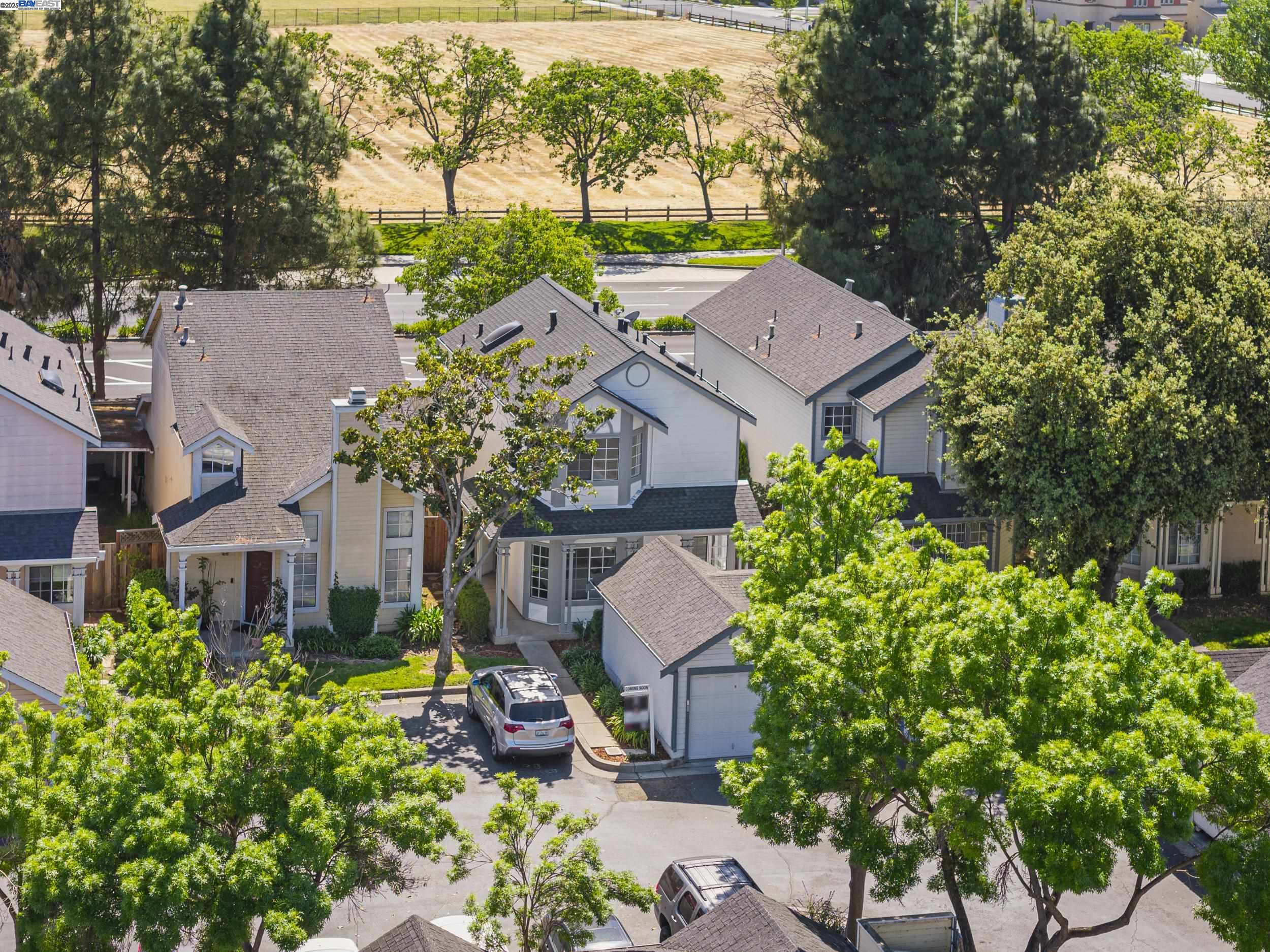 6453 Potrero Drive Newark, CA 94560 - Photo 31 of 34 an aerial view of a house with a yard and a large tree