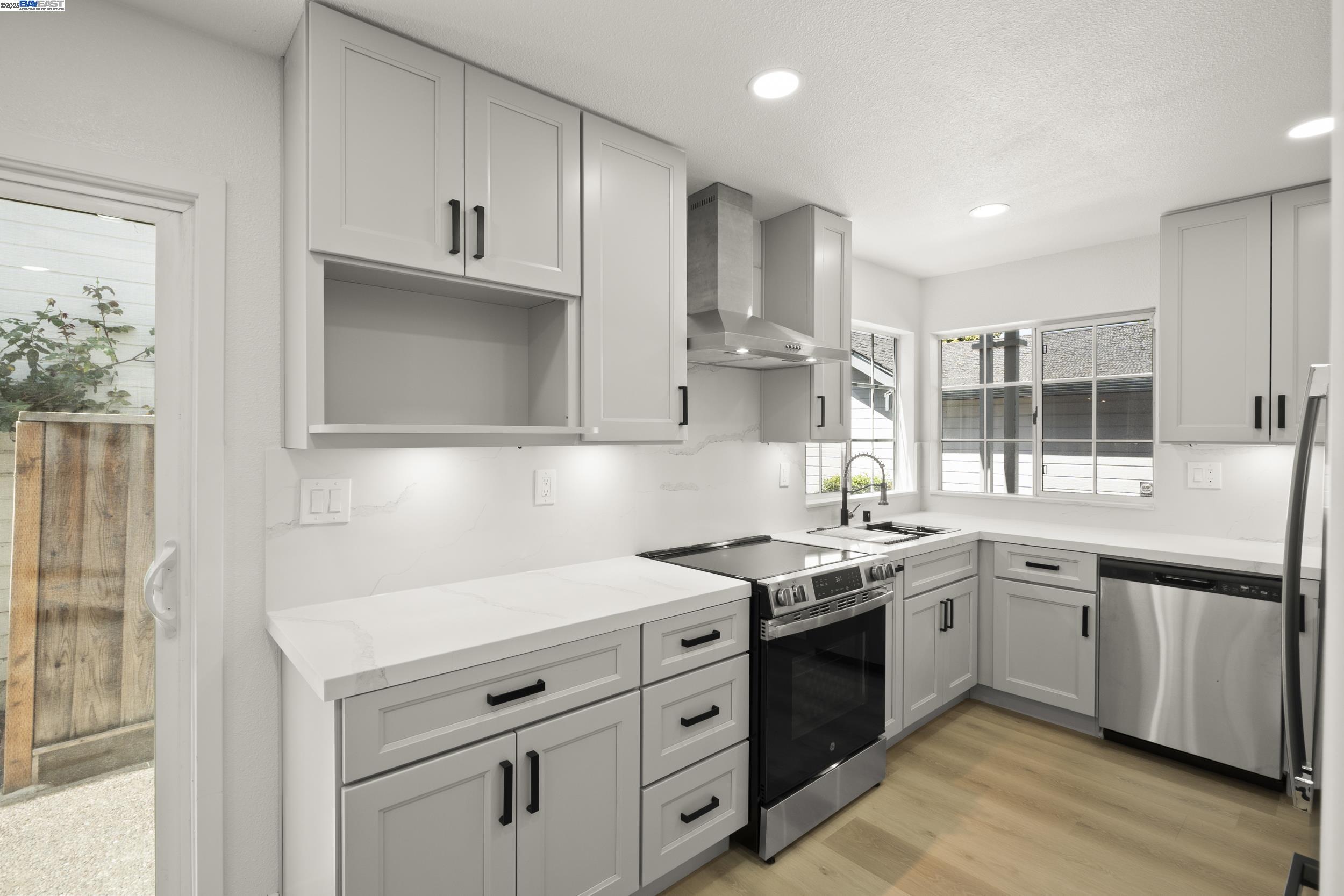 6453 Potrero Drive Newark, CA 94560 - Photo 9 of 34 a kitchen with a sink stove and cabinets