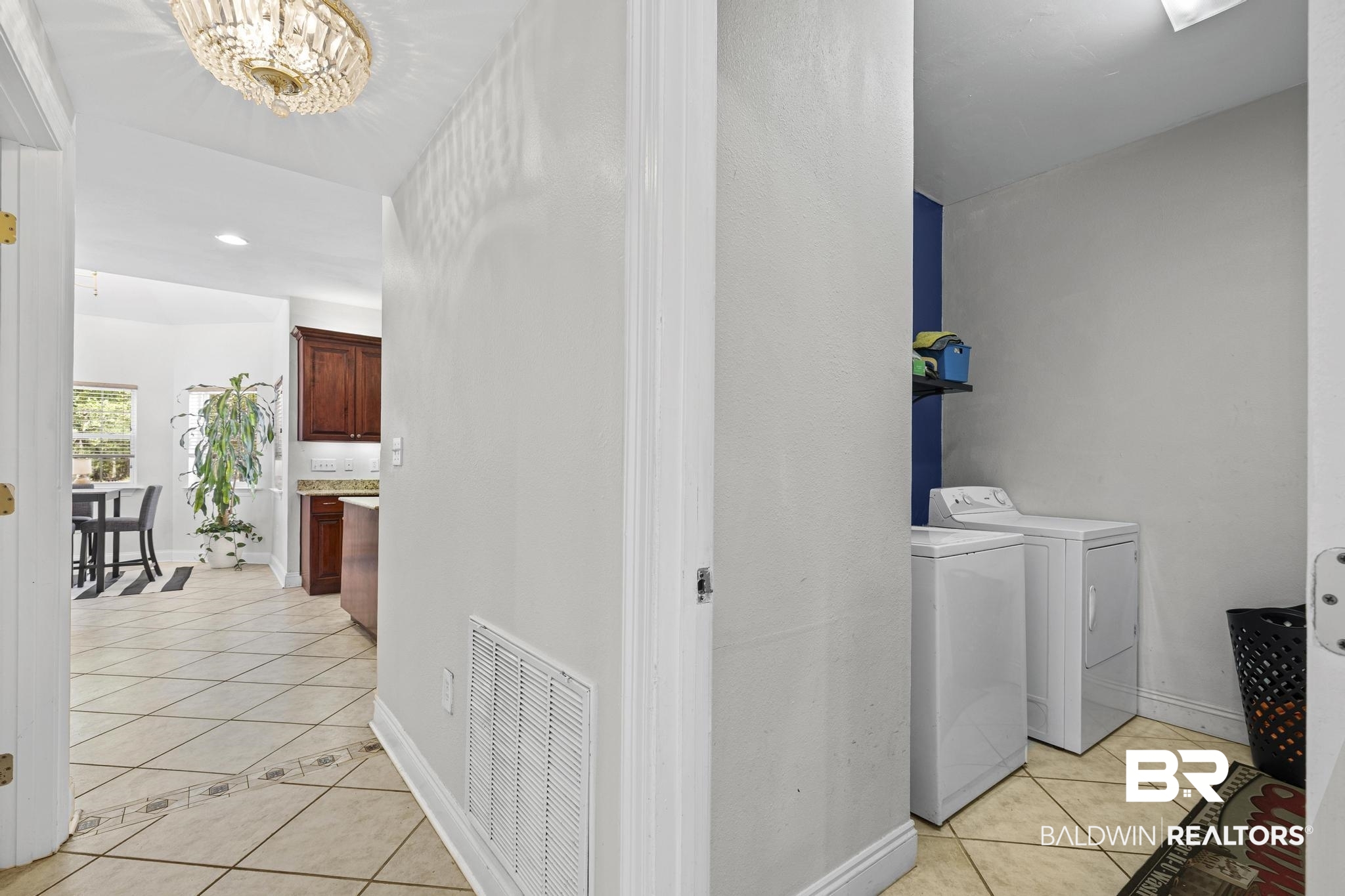 32875 Faircloth Road Lillian, AL 36549 - Photo 26 of 85 Laundry room featuring light tile patterned floors, washing machine and dryer, and recessed lighting