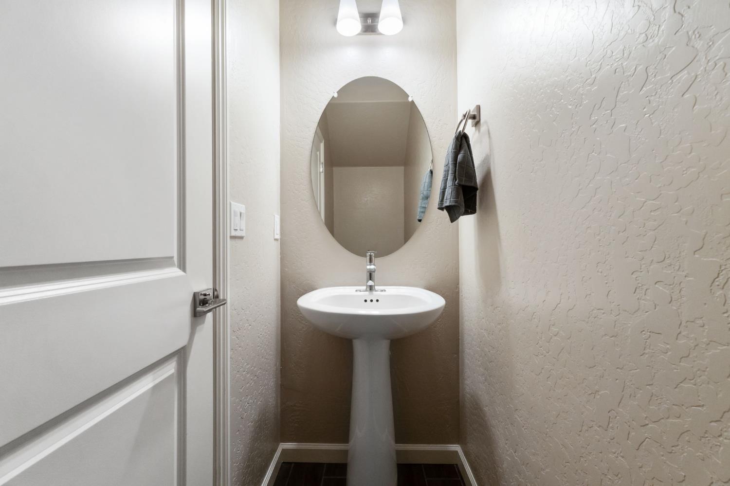 1106 Significant Way West Madera, CA 93636 - Photo 18 of 41 a bathroom with a sink and a mirror