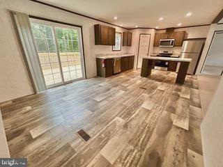7086 James Moore Road Port Norris, NJ 08349 - Photo 2 of 22 a open kitchen with stainless steel appliances granite countertop a sink and a stove