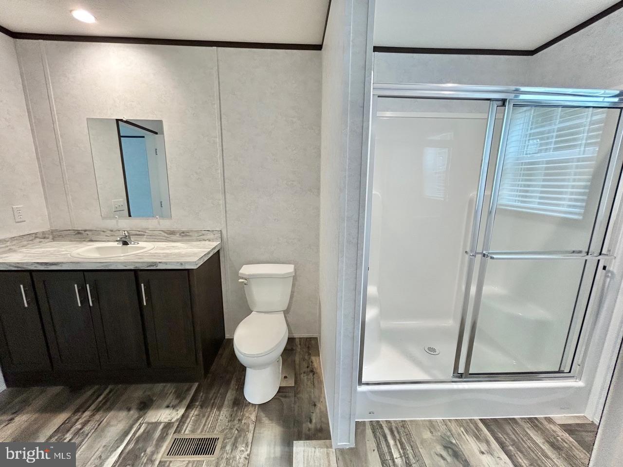 7086 James Moore Road Port Norris, NJ 08349 - Photo 10 of 22 a bathroom with a sink a toilet and shower